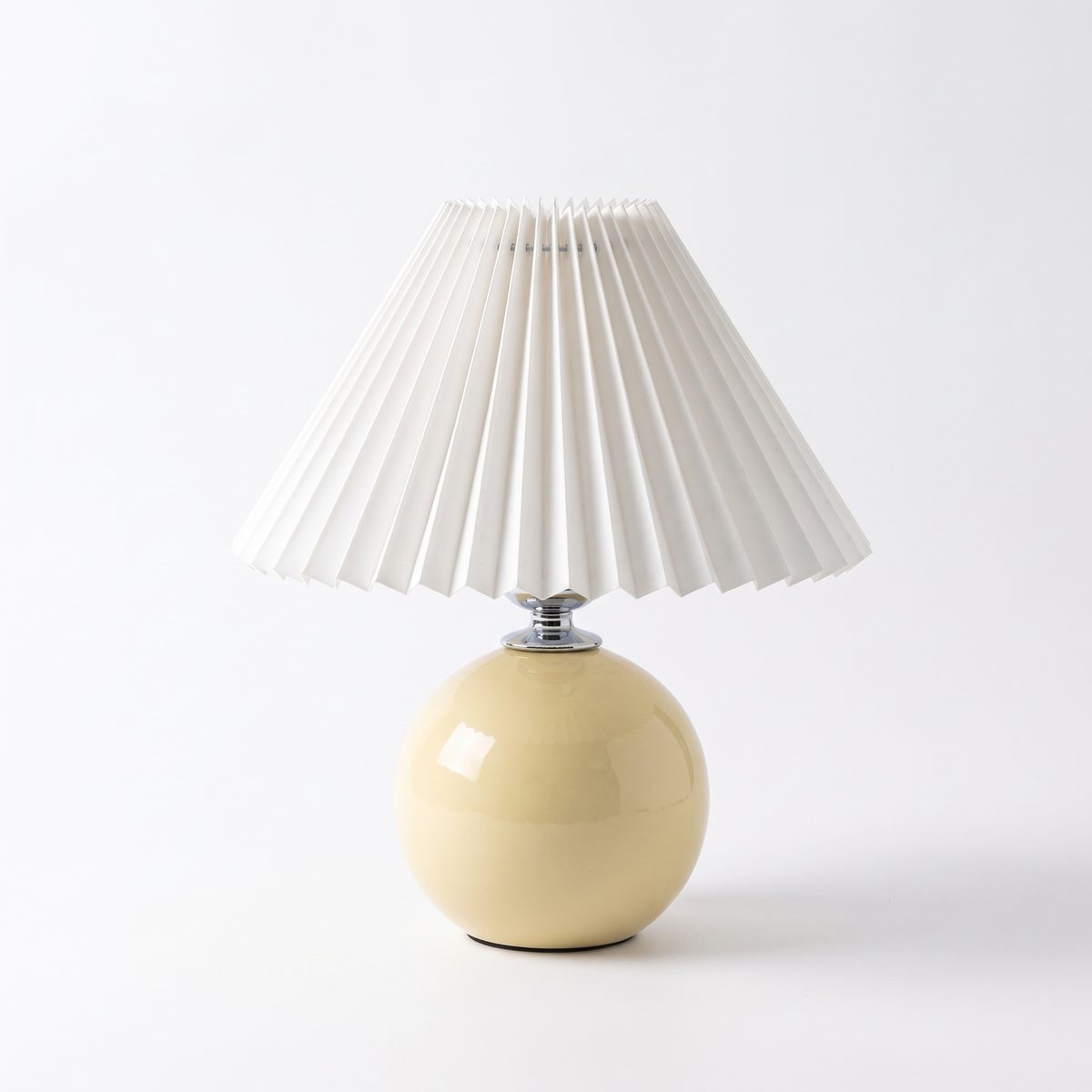 Ceramic table lamp with pleated shade – Yellow Base, White Shade, on a white background