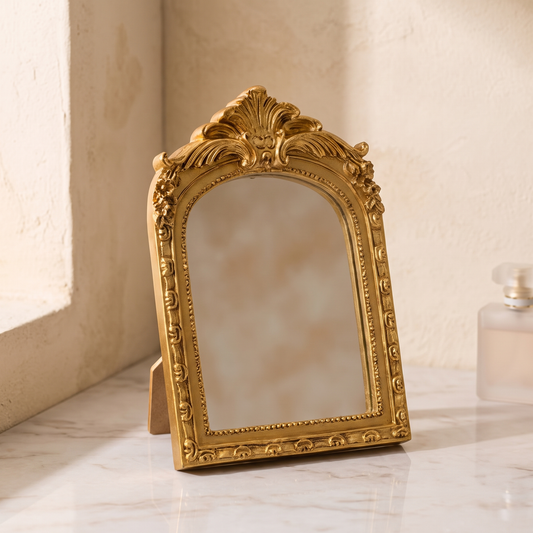 Gold baroque arched vanity mirror displayed in a warm modern interior