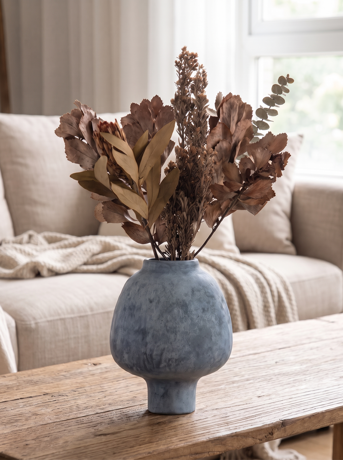 Pottery vase holding dried grasses