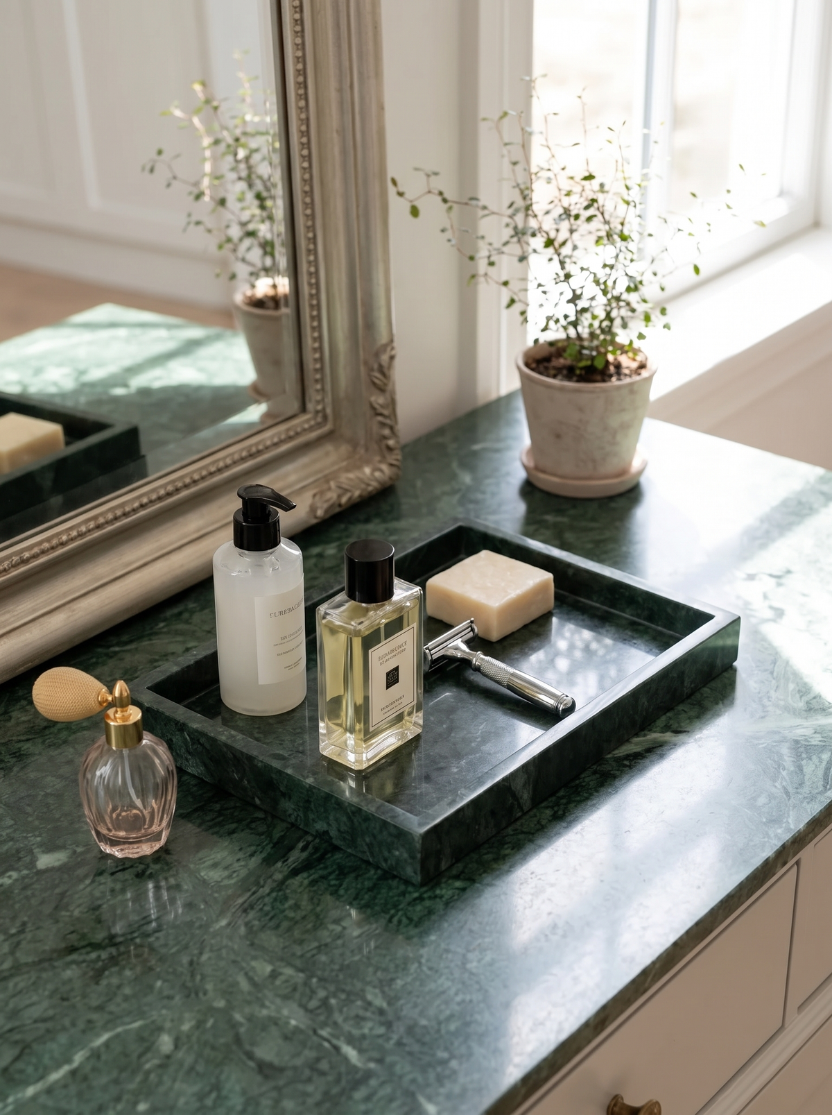 Green marble tray on a bedroom vanity