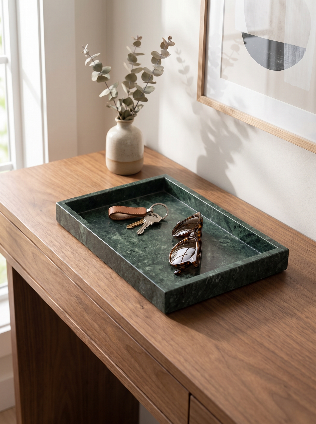 Marble tray holding keys on an entryway console