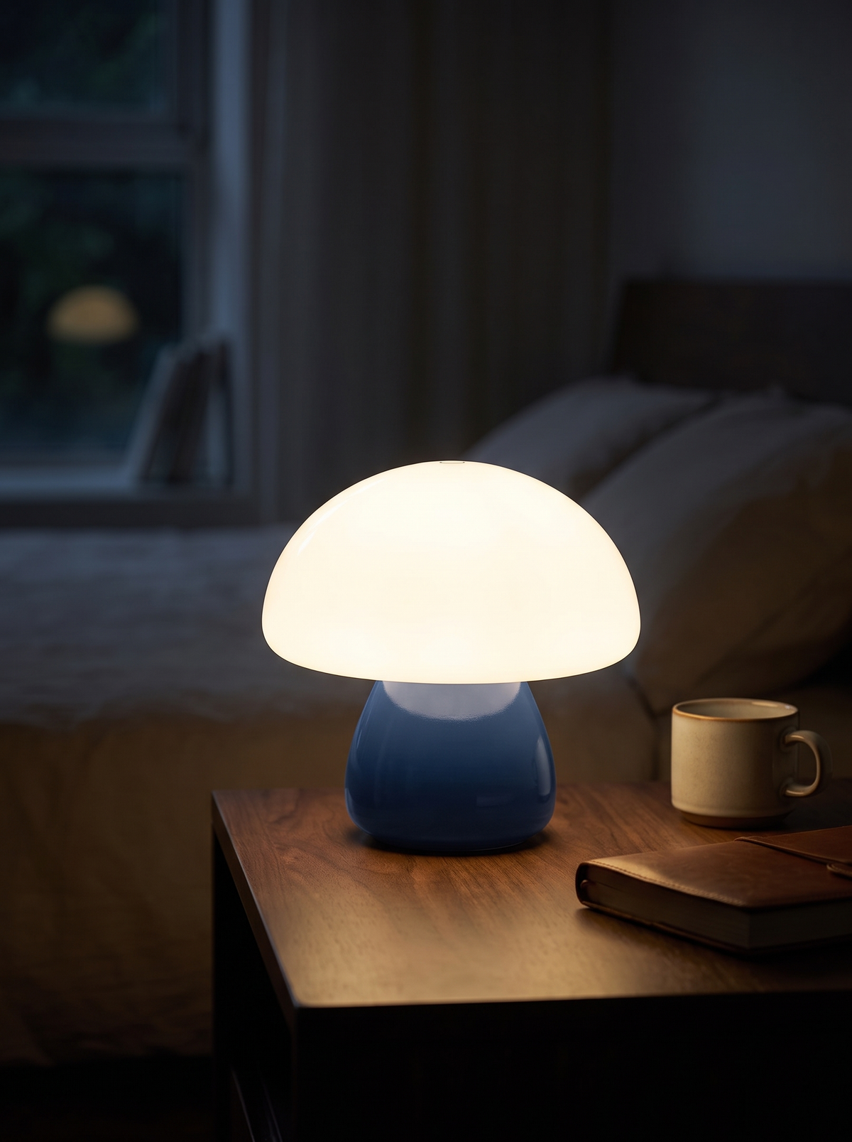 Mushroom LED lamp glowing on a bedside table