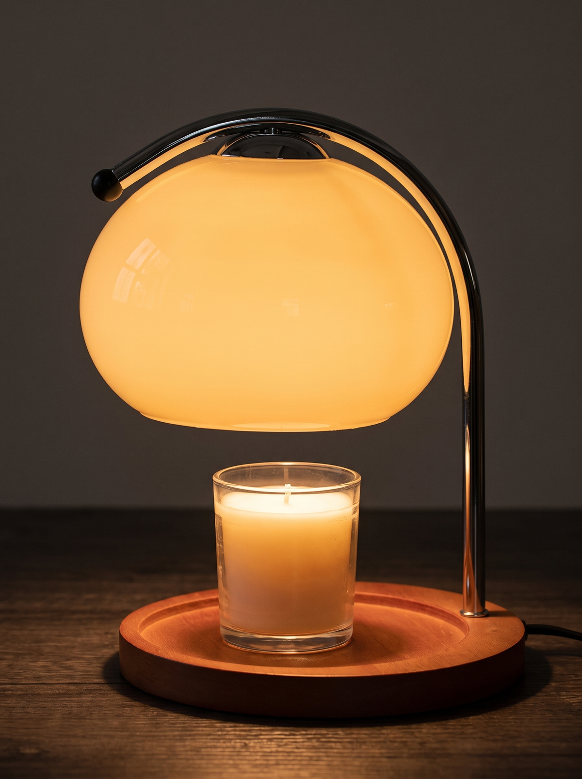 Close view of a retro glass lamp glowing amber