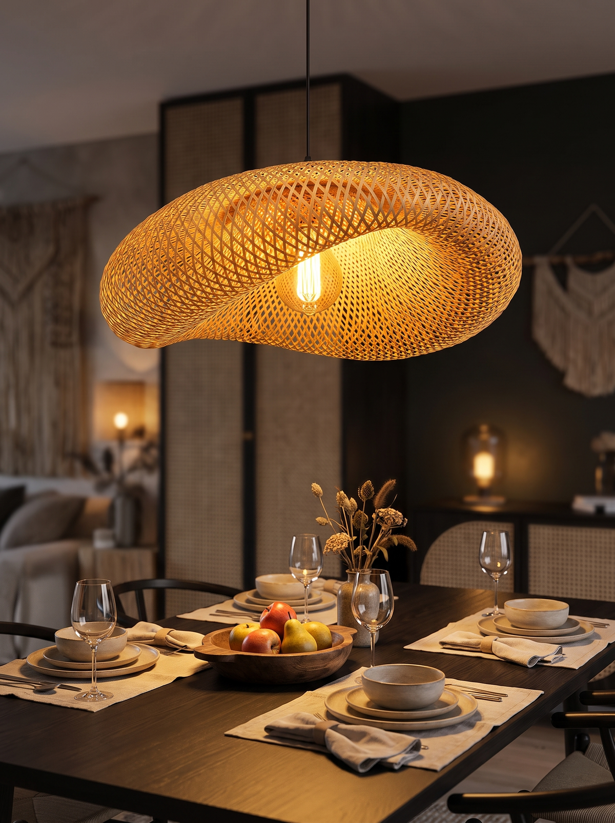 Bamboo pendant hanging low over a set dining table
