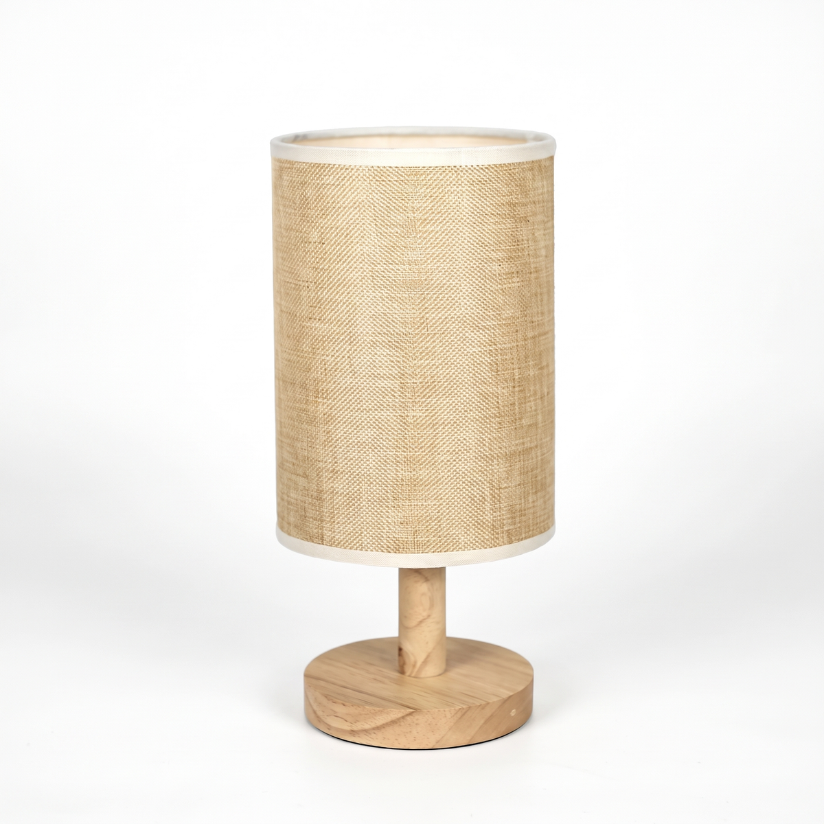 Japandi linen drum table lamp on a white background