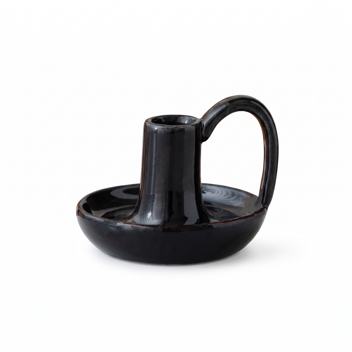 Minimal ceramic taper candle holder with handle – Black, on a white background