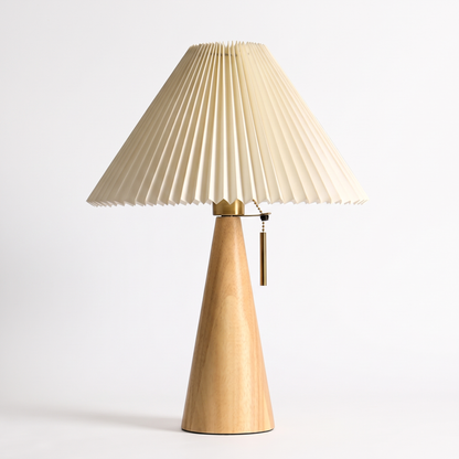 Oak table lamp with pleated shade on a white background