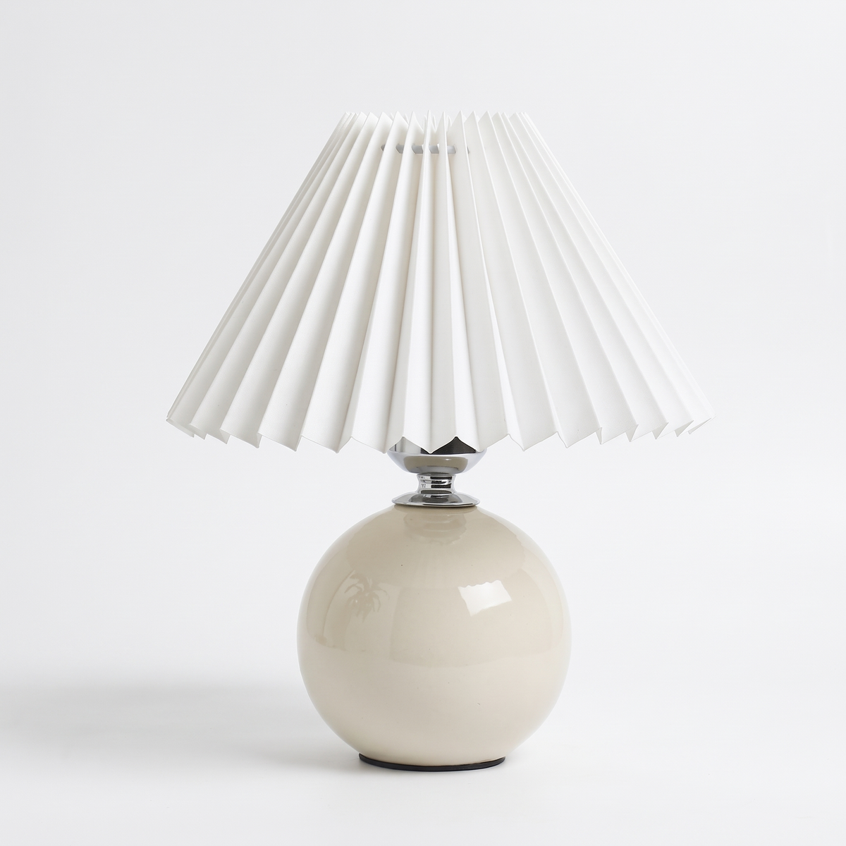 Rice white ceramic lamp with pleated shade on a white background