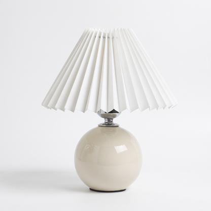 Rice white ceramic lamp with pleated shade on a white background